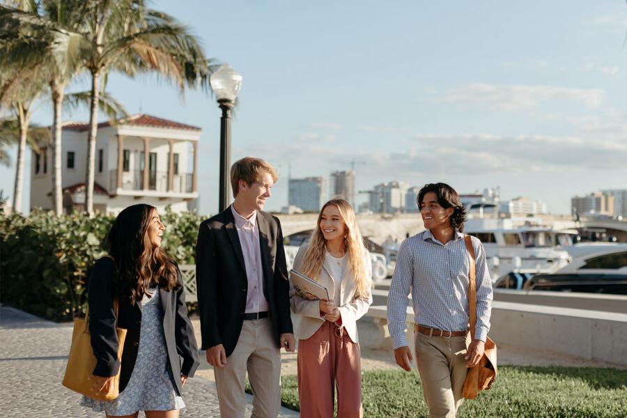 master of business administration mba students walk near the intercoastal waterway in 西<a href='http://g.wasfahokhaltah.com/'>推荐全球最大网赌正规平台欢迎您</a>.